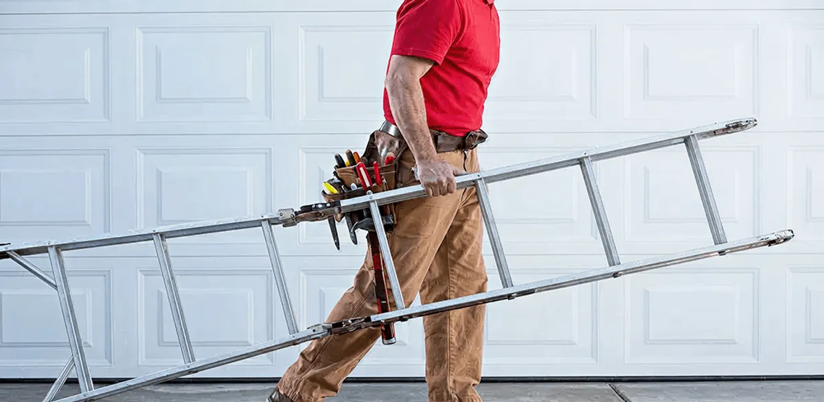 Garage door repair technician arriving with tools and ladder in Pembroke Pines, FL